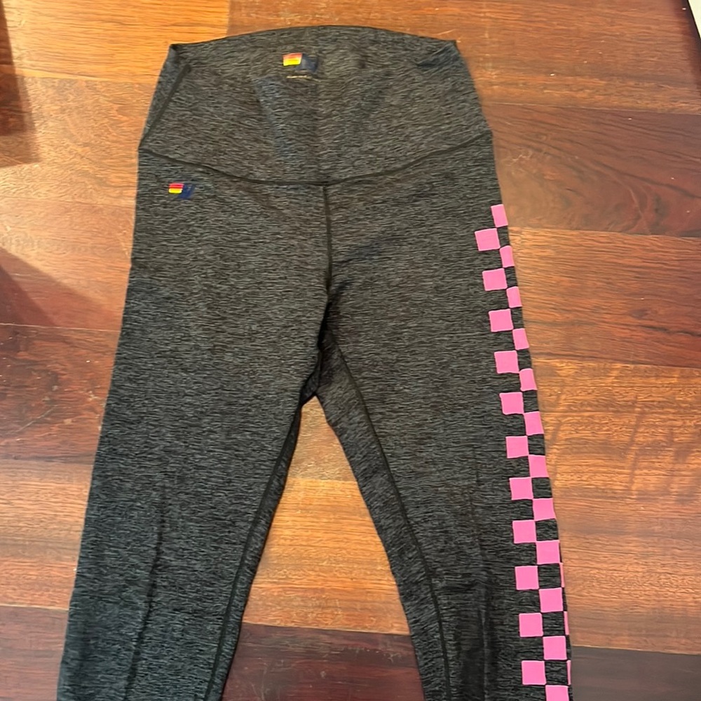 Aviator nation leggings with pink checkerboard down the side, size medium